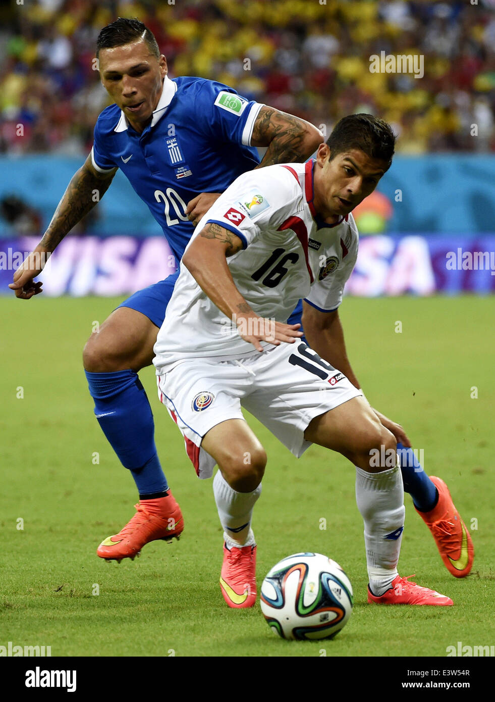 (140629) -- RECIFE, June 29, 2014 (Xinhua) -- Costa Rica's Christian Gamboa (front) vies with Greece's Jose Cholevas during a Round of 16 match between Costa Rica and Greece of 2014 FIFA World Cup at the Arena Pernambuco Stadium in Recife, Brazil, on June 29, 2014.(Xinhua/Lui Siu Wai)(pcy) Stock Photo