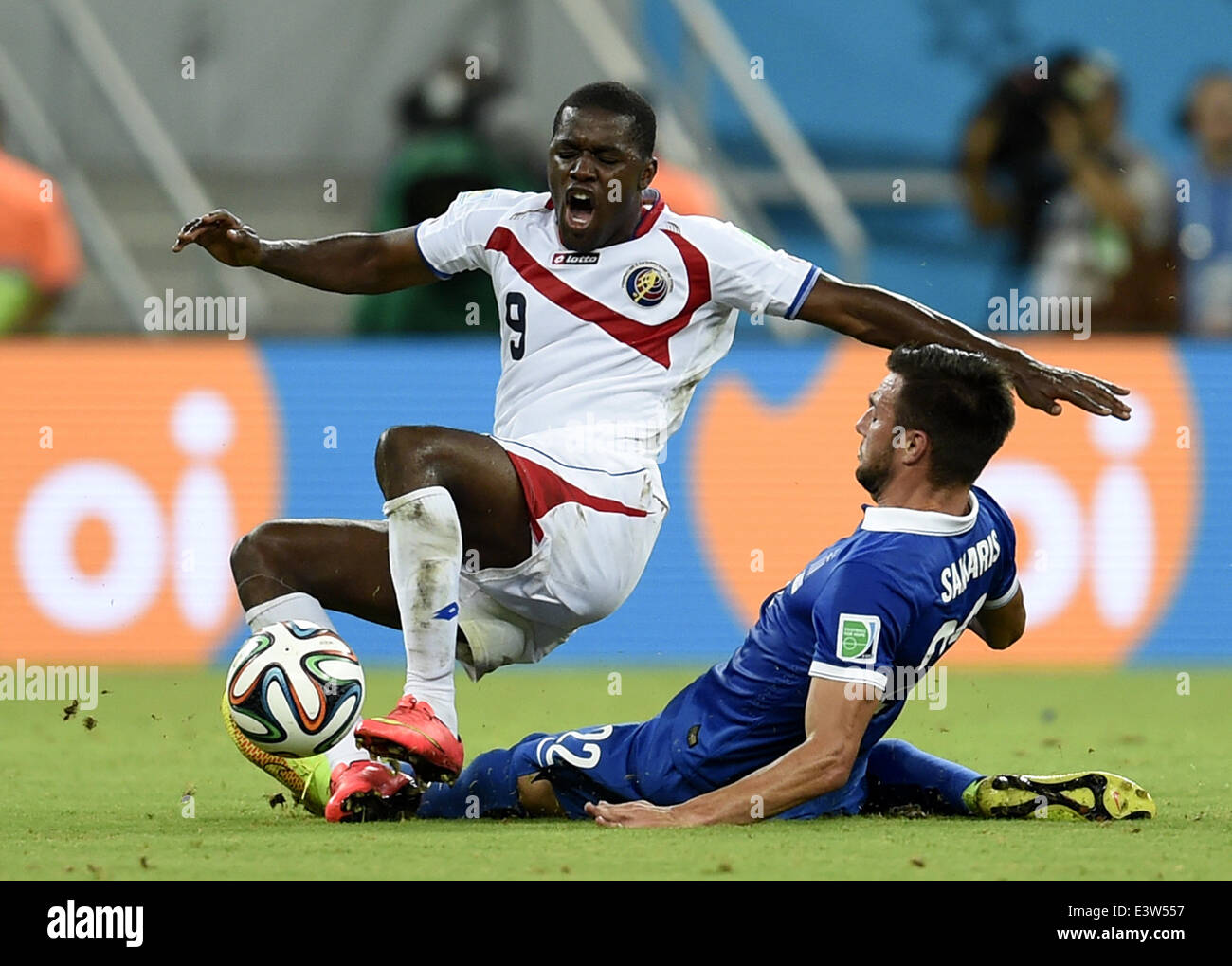 (140629) -- RECIFE, June 29, 2014 (Xinhua) -- Costa Rica's Joel Campbell (top) vies with Greece's Andreas Samaris during a Round of 16 match between Costa Rica and Greece of 2014 FIFA World Cup at the Arena Pernambuco Stadium in Recife, Brazil, on June 29, 2014.(Xinhua/Yang Lei)(xzj) Stock Photo