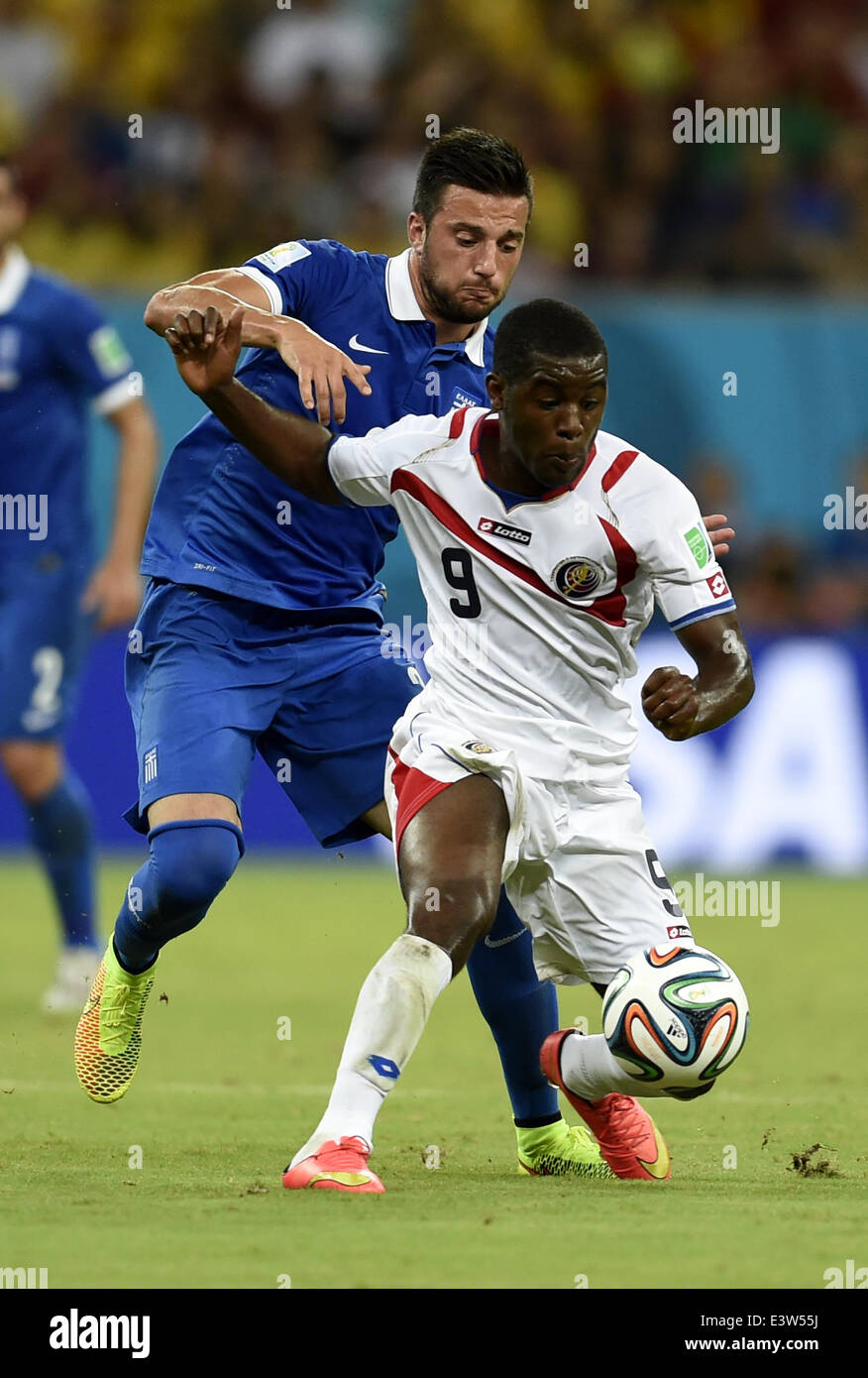 (140629) -- RECIFE, June 29, 2014 (Xinhua) -- Costa Rica's Joel Campbell (front) competes during a Round of 16 match between Costa Rica and Greece of 2014 FIFA World Cup at the Arena Pernambuco Stadium in Recife, Brazil, on June 29, 2014.(Xinhua/Yang Lei)(xzj) Stock Photo