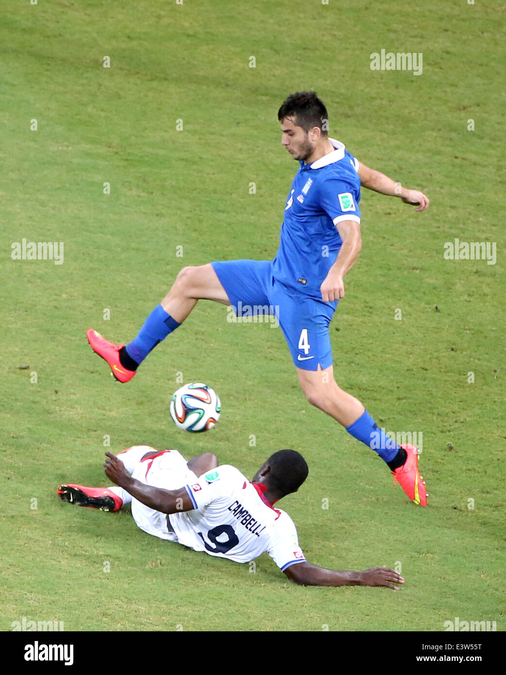 Recife, Brazil. 29th June, 2014. Costa Rica's Joel Campbell vies with Greece's Kostas Manolas during a Round of 16 match between Costa Rica and Greece of 2014 FIFA World Cup at the Arena Pernambuco Stadium in Recife, Brazil, on June 29, 2014. Credit:  Cao Can/Xinhua/Alamy Live News Stock Photo