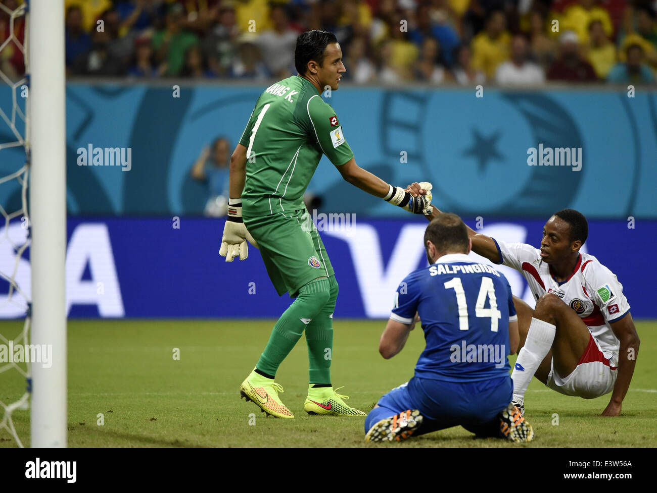 Recife, Brazil. 29th June, 2014. Costa Rica's goalkeeper Keilor Navas (L) pulls up Celso Borges (R) who defends against the attack of Greece's Dimitris Salpingidis (C) during a Round of 16 match between Costa Rica and Greece of 2014 FIFA World Cup at the Arena Pernambuco Stadium in Recife, Brazil, on June 29, 2014. Credit:  Lui Siu Wai/Xinhua/Alamy Live News Stock Photo