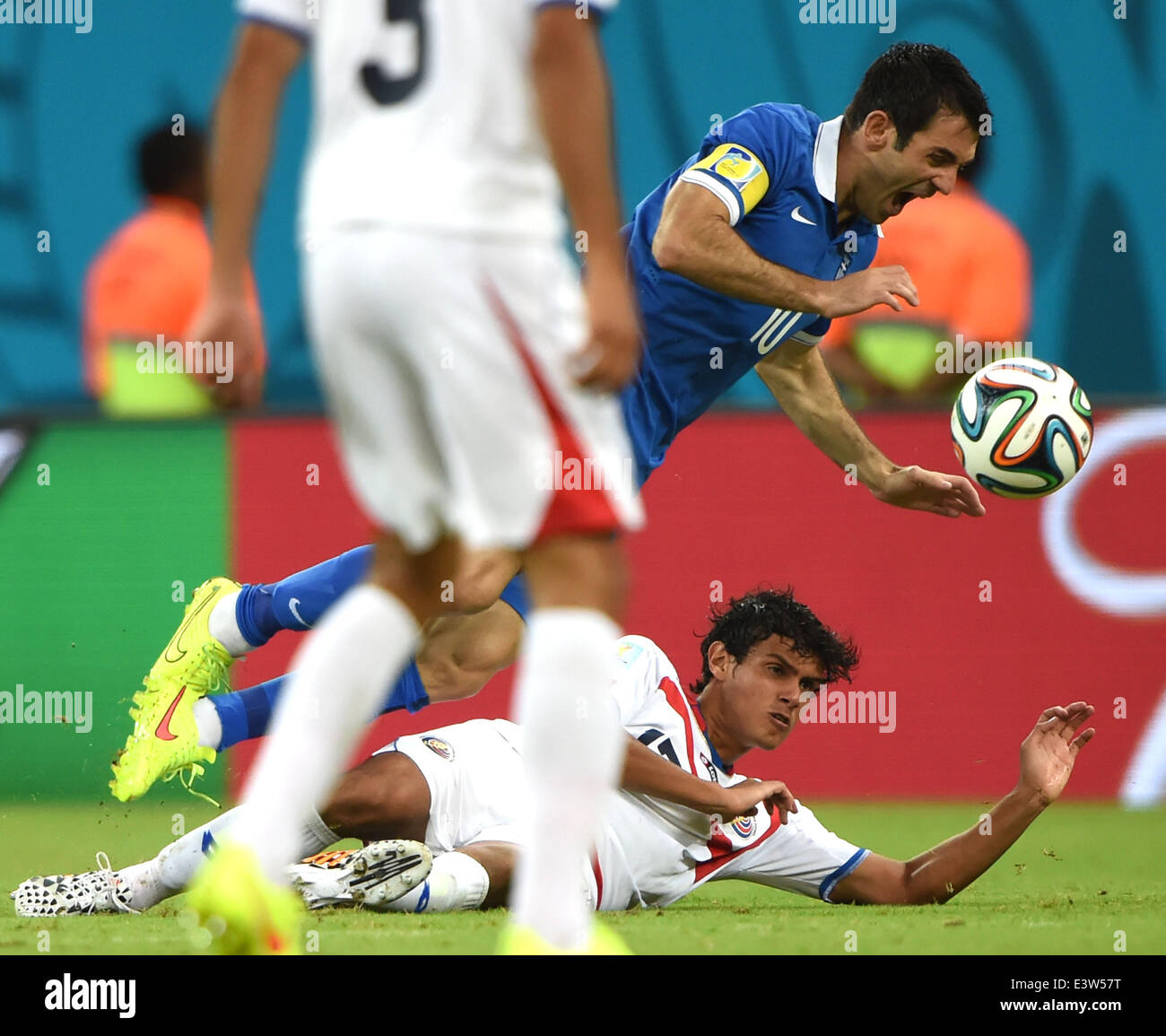 Recife, Brazil. 29th June, 2014. Greece's Giorgos Karagounis (C) falls down during a Round of 16 match between Costa Rica and Greece of 2014 FIFA World Cup at the Arena Pernambuco Stadium in Recife, Brazil, on June 29, 2014. Credit:  Guo Yong/Xinhua/Alamy Live News Stock Photo