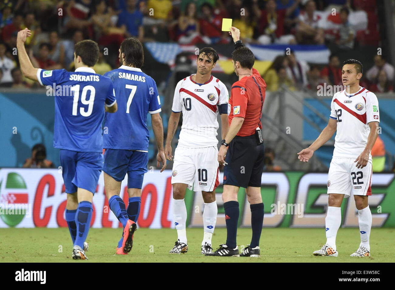 Recife, Brazil. 29th June, 2014. Australia's referee Benjamin Williams (2nd R) shows a yellow card to Costa Rica's Bryan Ruiz (3rd R) during a Round of 16 match between Costa Rica and Greece of 2014 FIFA World Cup at the Arena Pernambuco Stadium in Recife, Brazil, on June 29, 2014. Credit:  Lui Siu Wai/Xinhua/Alamy Live News Stock Photo