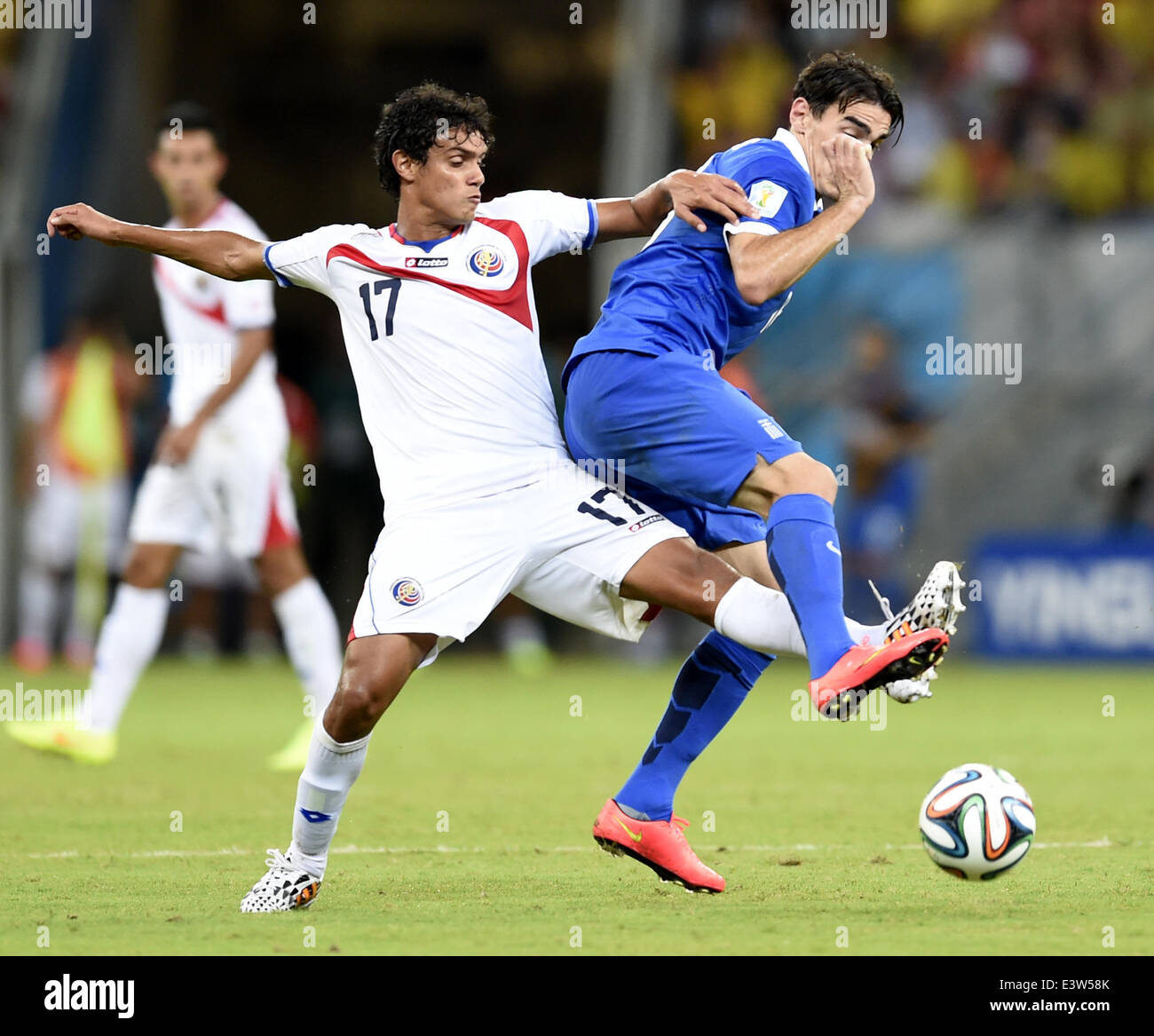 Recife, Brazil. 29th June, 2014. Costa Rica's Yeltsin Tejeda (L) competes during a Round of 16 match between Costa Rica and Greece of 2014 FIFA World Cup at the Arena Pernambuco Stadium in Recife, Brazil, on June 29, 2014. Credit:  Yang Lei/Xinhua/Alamy Live News Stock Photo