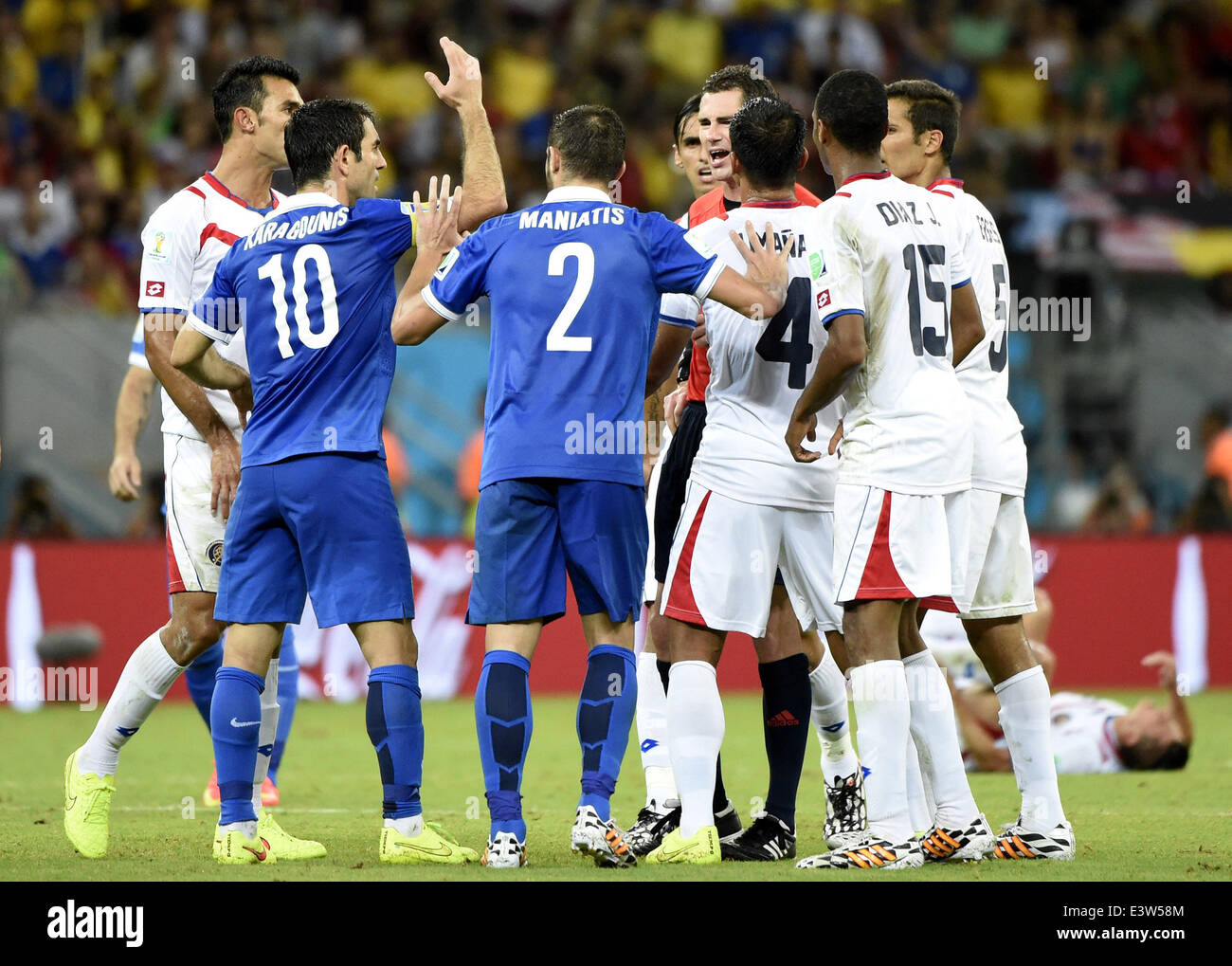 Recife, Brazil. 29th June, 2014. Greece's Giorgos Karagounis (2nd L) argues with Australia's referee Benjamin Williams (4th R) during a Round of 16 match between Costa Rica and Greece of 2014 FIFA World Cup at the Arena Pernambuco Stadium in Recife, Brazil, on June 29, 2014. Credit:  Lui Siu Wai/Xinhua/Alamy Live News Stock Photo