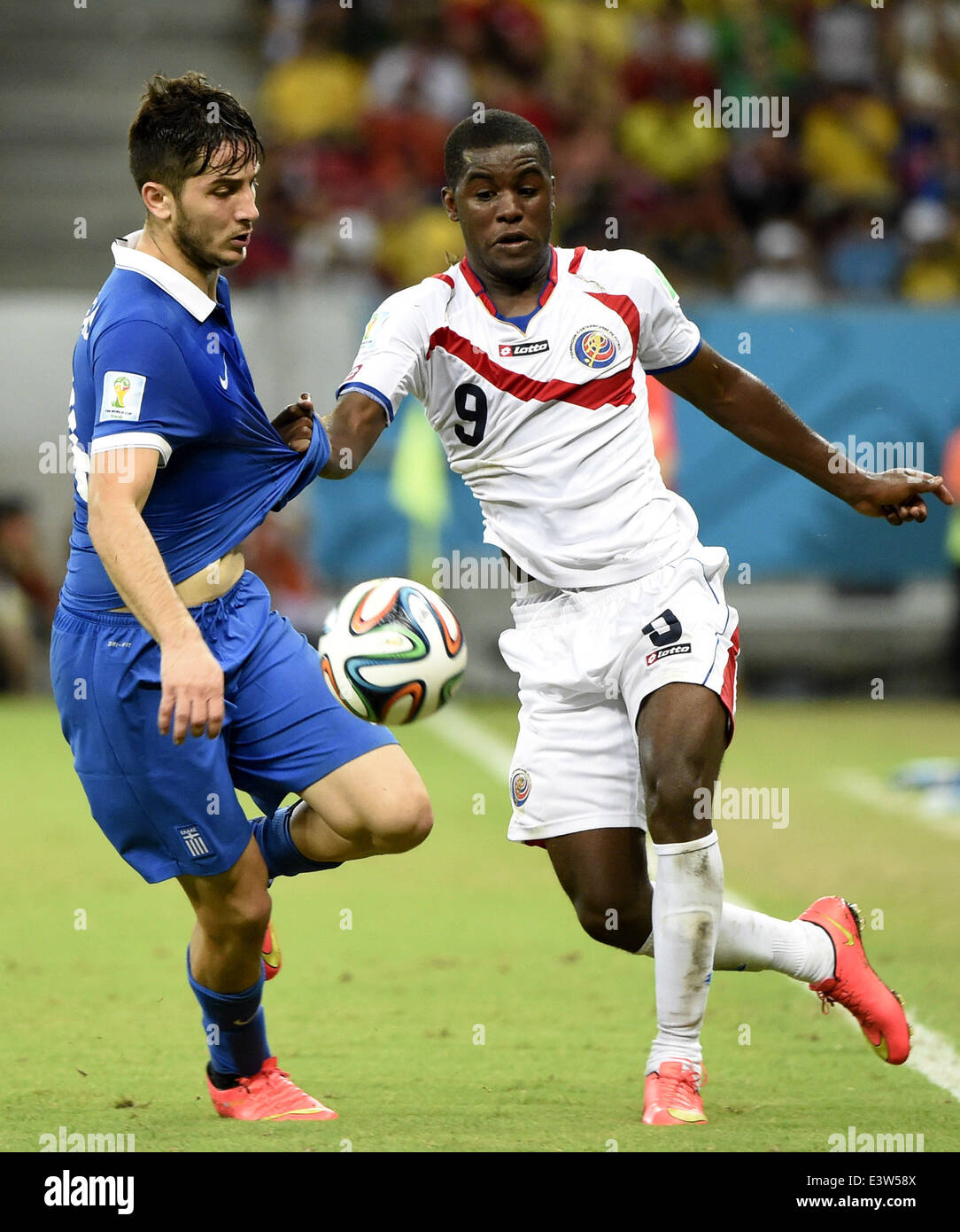 Recife, Brazil. 29th June, 2014. Costa Rica's Joel Campbell (R) breaks through during a Round of 16 match between Costa Rica and Greece of 2014 FIFA World Cup at the Arena Pernambuco Stadium in Recife, Brazil, on June 29, 2014. Credit:  Lui Siu Wai/Xinhua/Alamy Live News Stock Photo