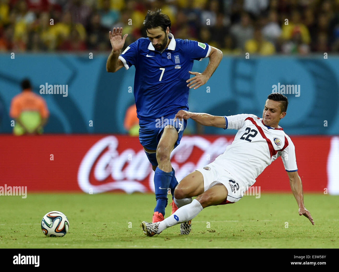 Recife, Brazil. 29th June, 2014. Costa Rica's Jose Miguel Cubero (R) vies with Greece's Giorgios Samaras during a Round of 16 match between Costa Rica and Greece of 2014 FIFA World Cup at the Arena Pernambuco Stadium in Recife, Brazil, on June 29, 2014. Credit:  Yang Lei/Xinhua/Alamy Live News Stock Photo