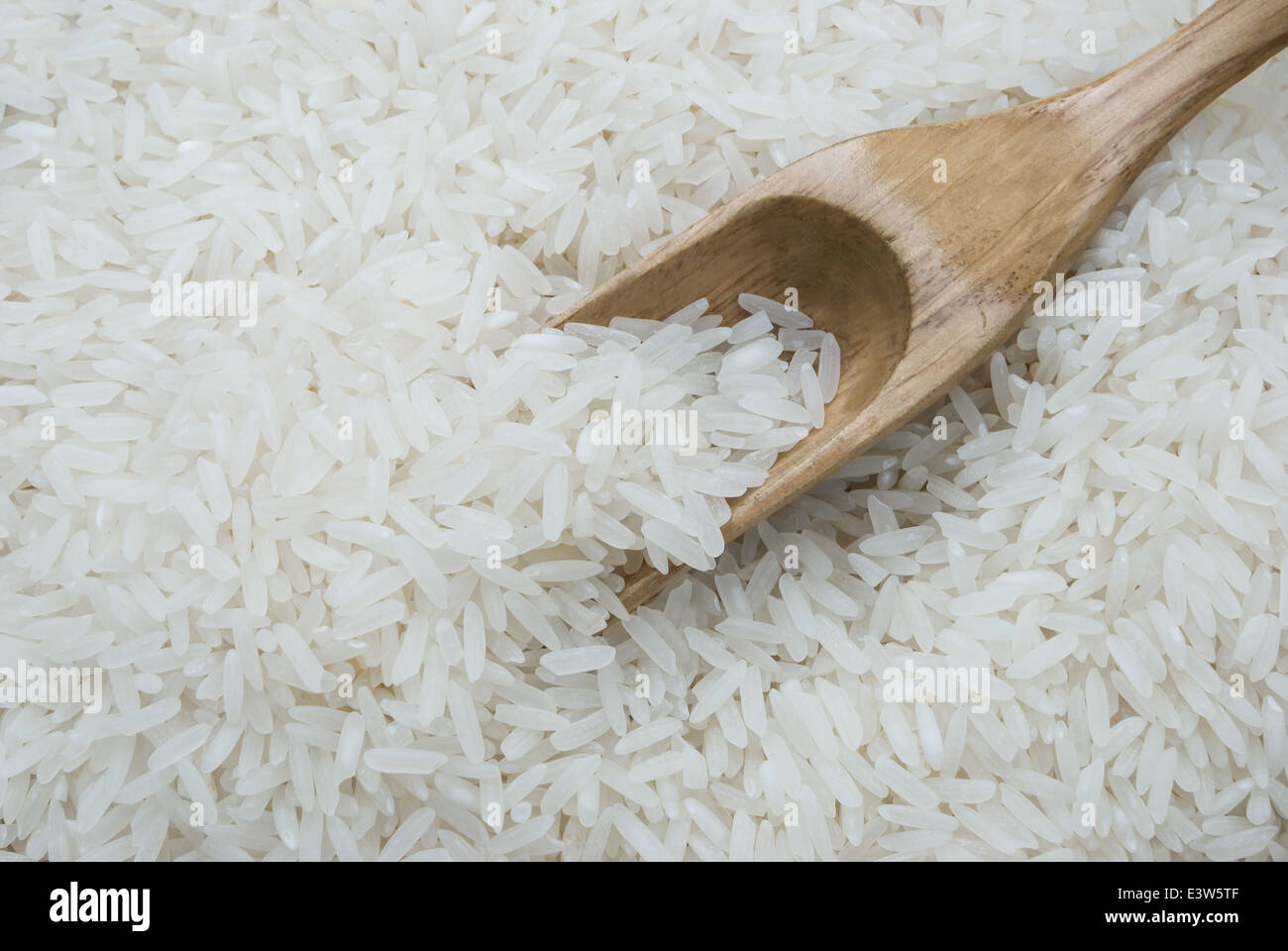 rice with a wooden spoon Stock Photo - Alamy