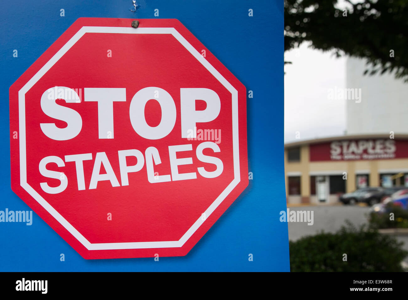 A sign protesting the opening of contract United States Post Office branches inside of Staples retail stores in Silver, Maryland. Stock Photo