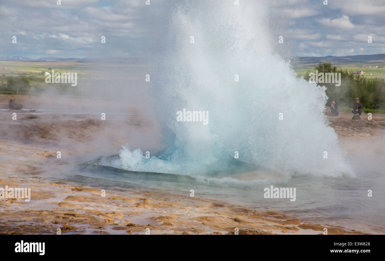 Geyser and blurred tourists Stock Photo