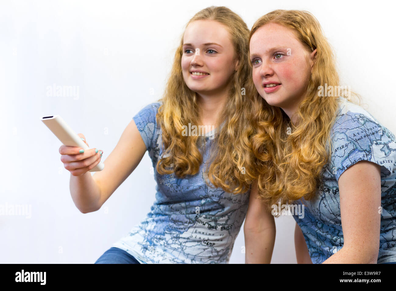 Two girls watching TV Stock Photo