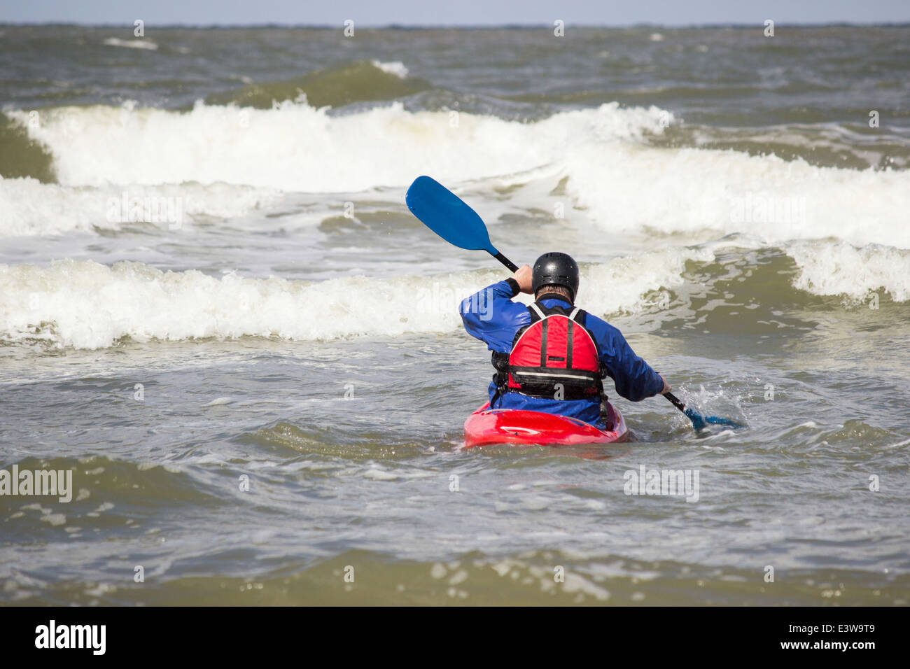 Man in kayak on waves of the sea Stock Photo Alamy