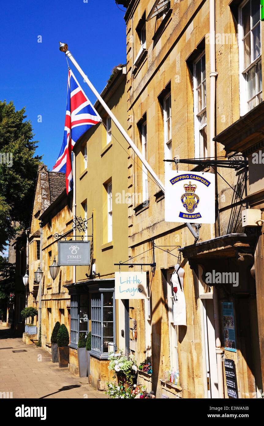 Union Jack flag on a flagpole attached the wall of the Royal British Legion building along the High Street, Chipping Campden, UK Stock Photo