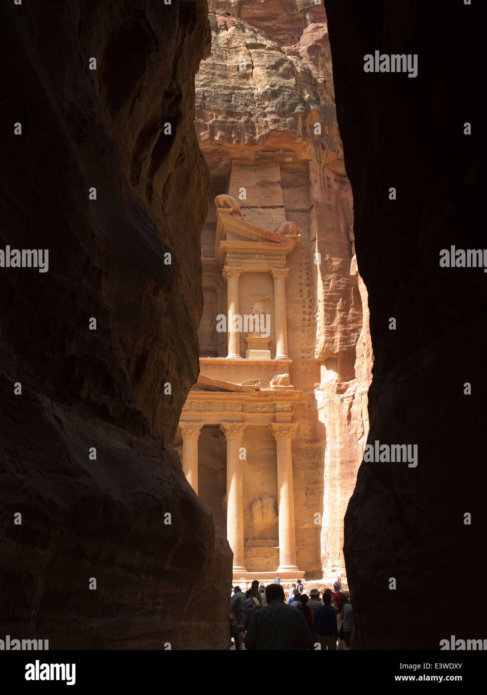 Jordan, Arabah, Petra, first view of the Treasury, Khazneh Al Firaun from Al-Siq entrance canyon to site Stock Photo