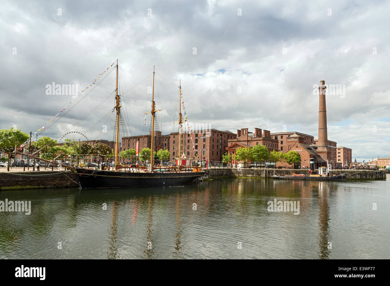Sailboat docked near the Dock's former pump house, Liverpool England. Stock Photo