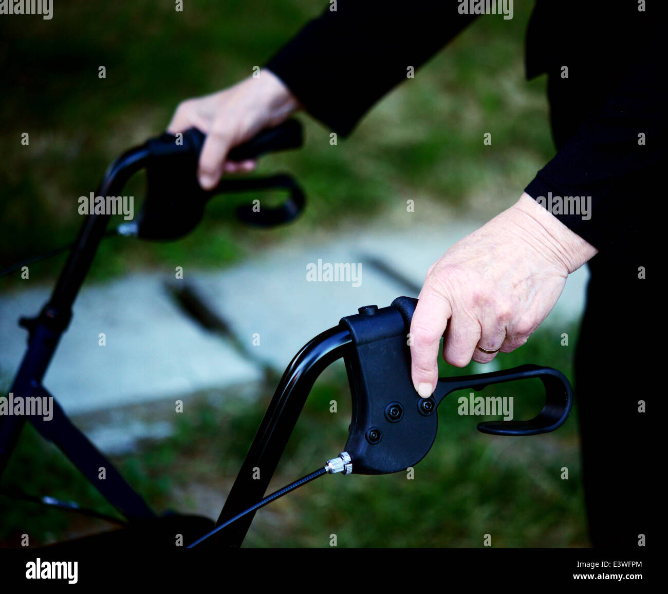 Old lady with walking frame hi-res stock photography and images - Alamy