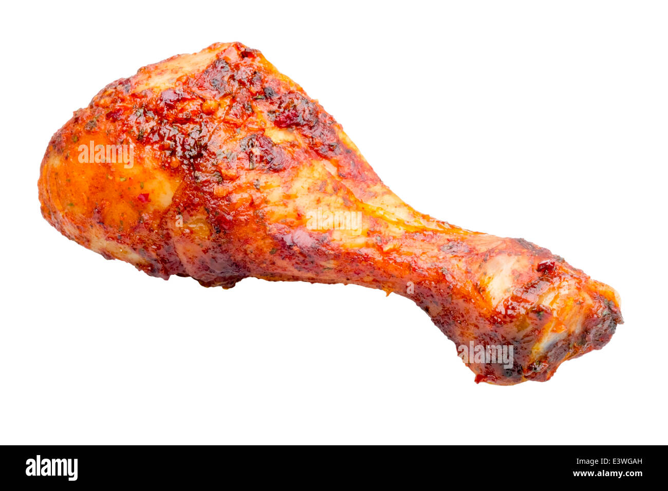 Chicken drumstick cooked with sweet chili sauce, isolated against a white background. Stock Photo