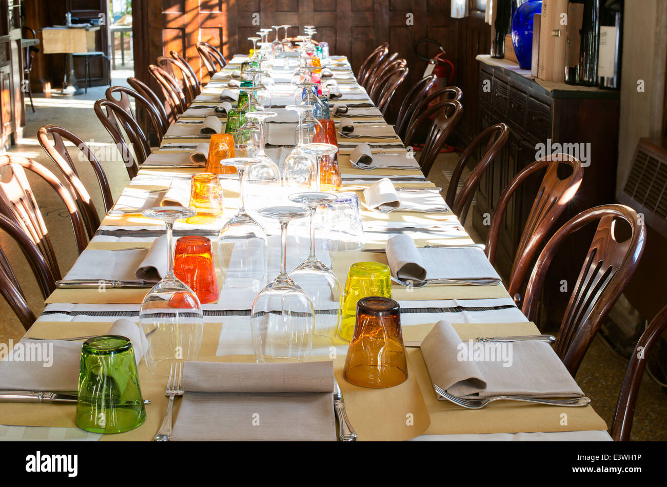 Table in an Italian restaurant. Wooden antique furniture Stock Photo