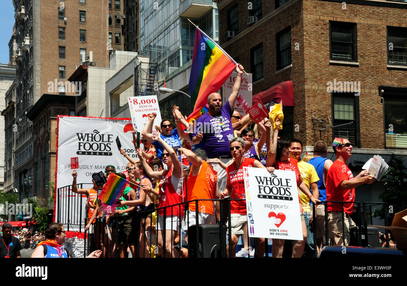 NYC: Riders on the Whole Foods / God's Love We Deliver float at the 2014 Gay Pride Parade on Fifth Avenue Stock Photo