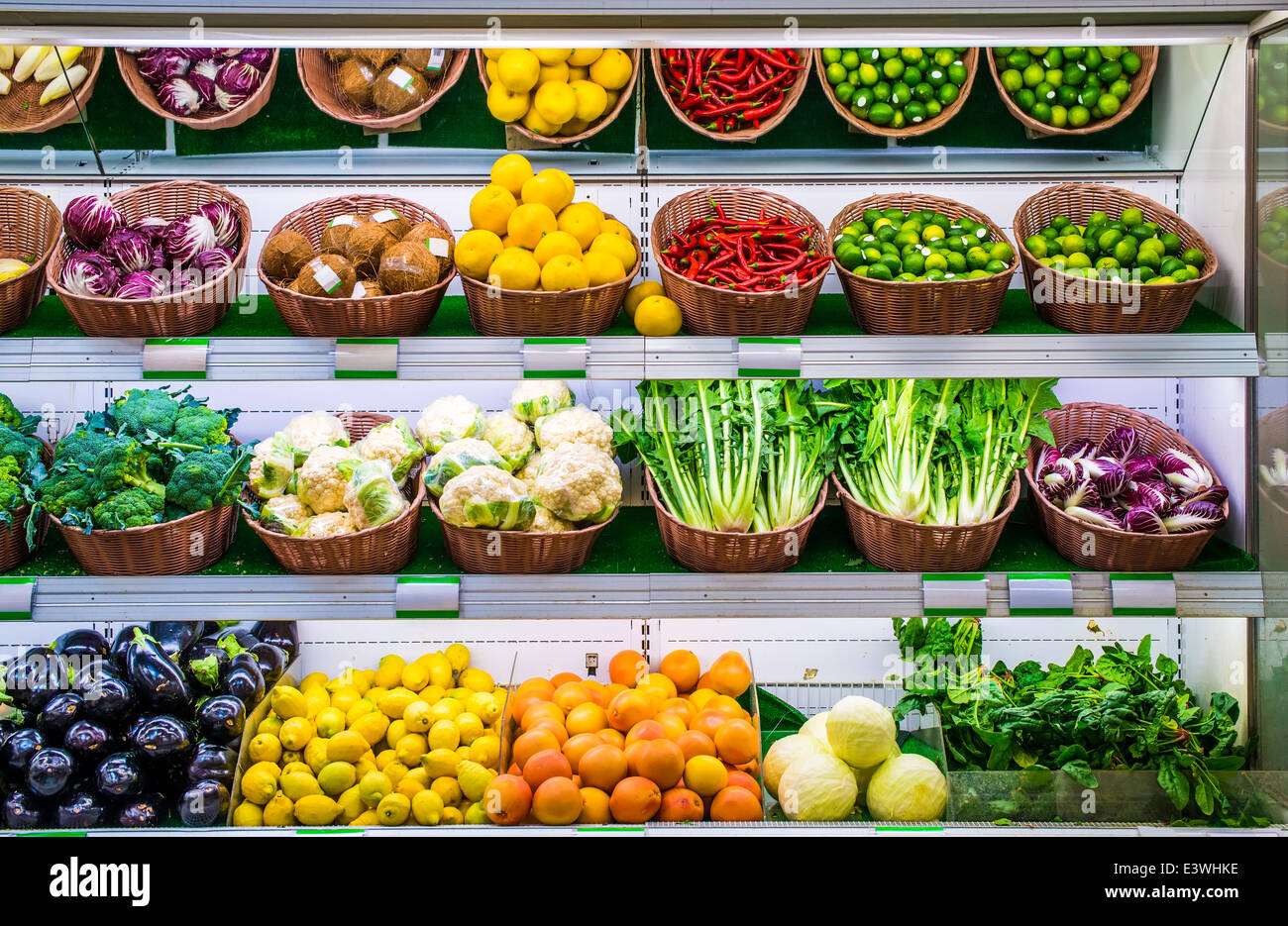 Fruits and vegetables on a supermarket shelf. Stock Photo