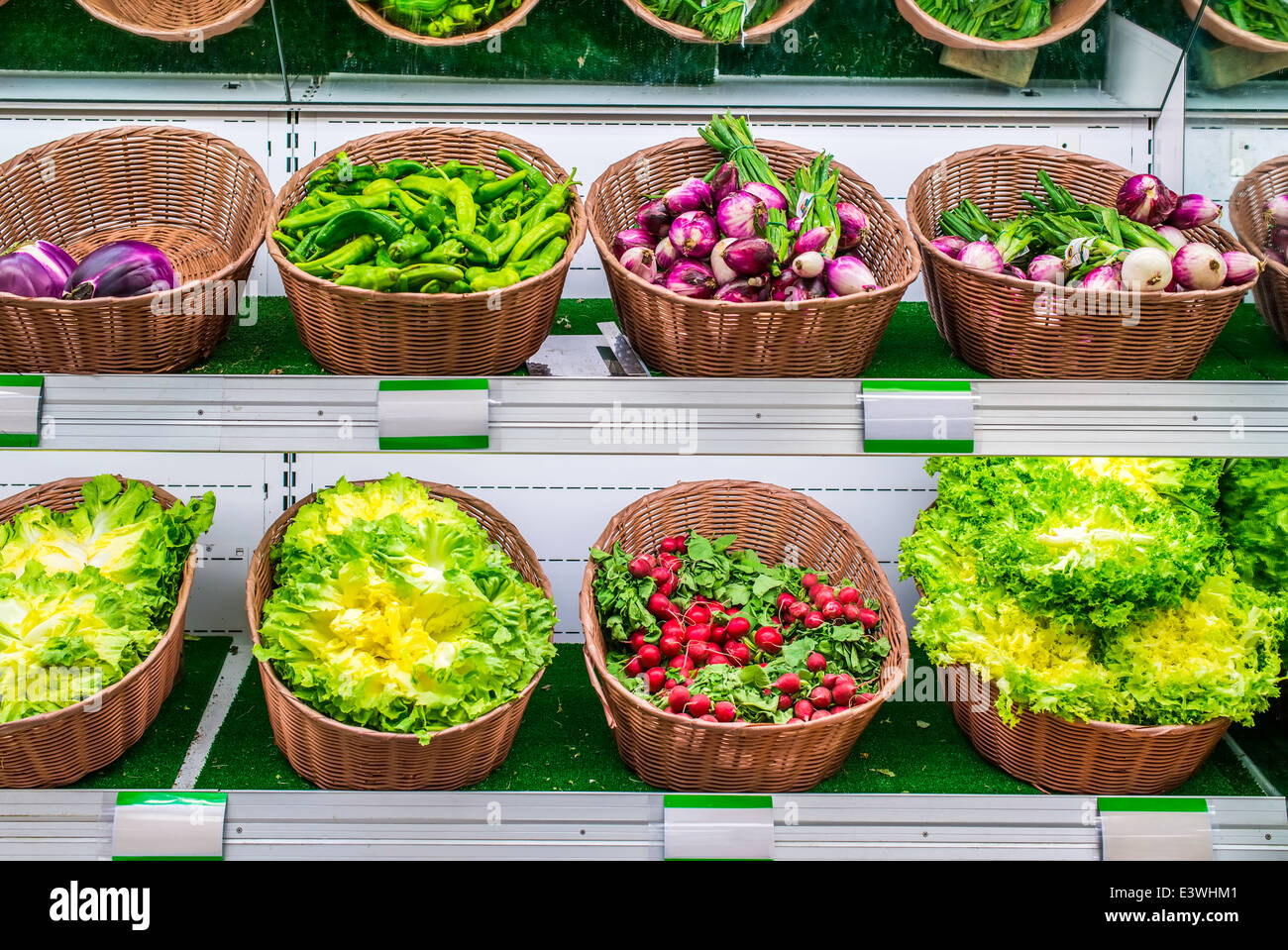 Fruits and vegetables on a supermarket shelf. Stock Photo
