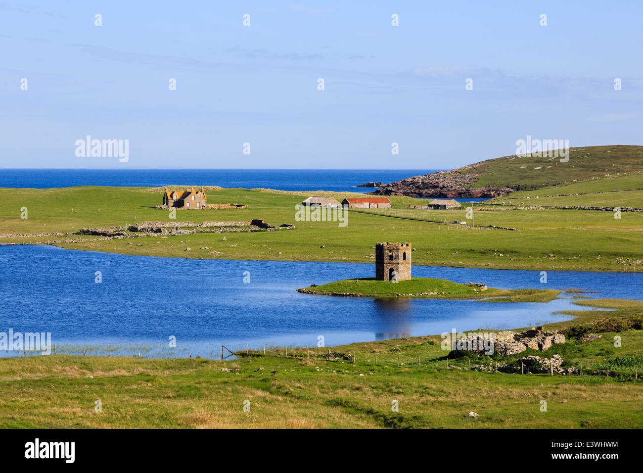 View to Loch Scolpaig with Georgian folly Tower on small islet on west coast North Uist Outer Hebrides Western Isles Scotland UK Stock Photo