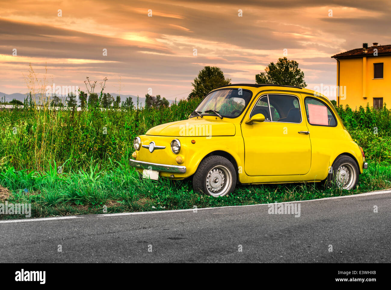 Small vintage italian car Fiat Abarth. Yellow color Stock Photo