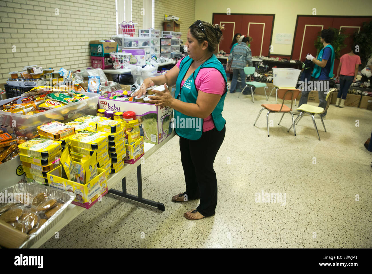 volunteers at Catholic Charity shelter in McAllen, Texas. Surge of immigrants from Central America crossed  Texas-Mexico border Stock Photo