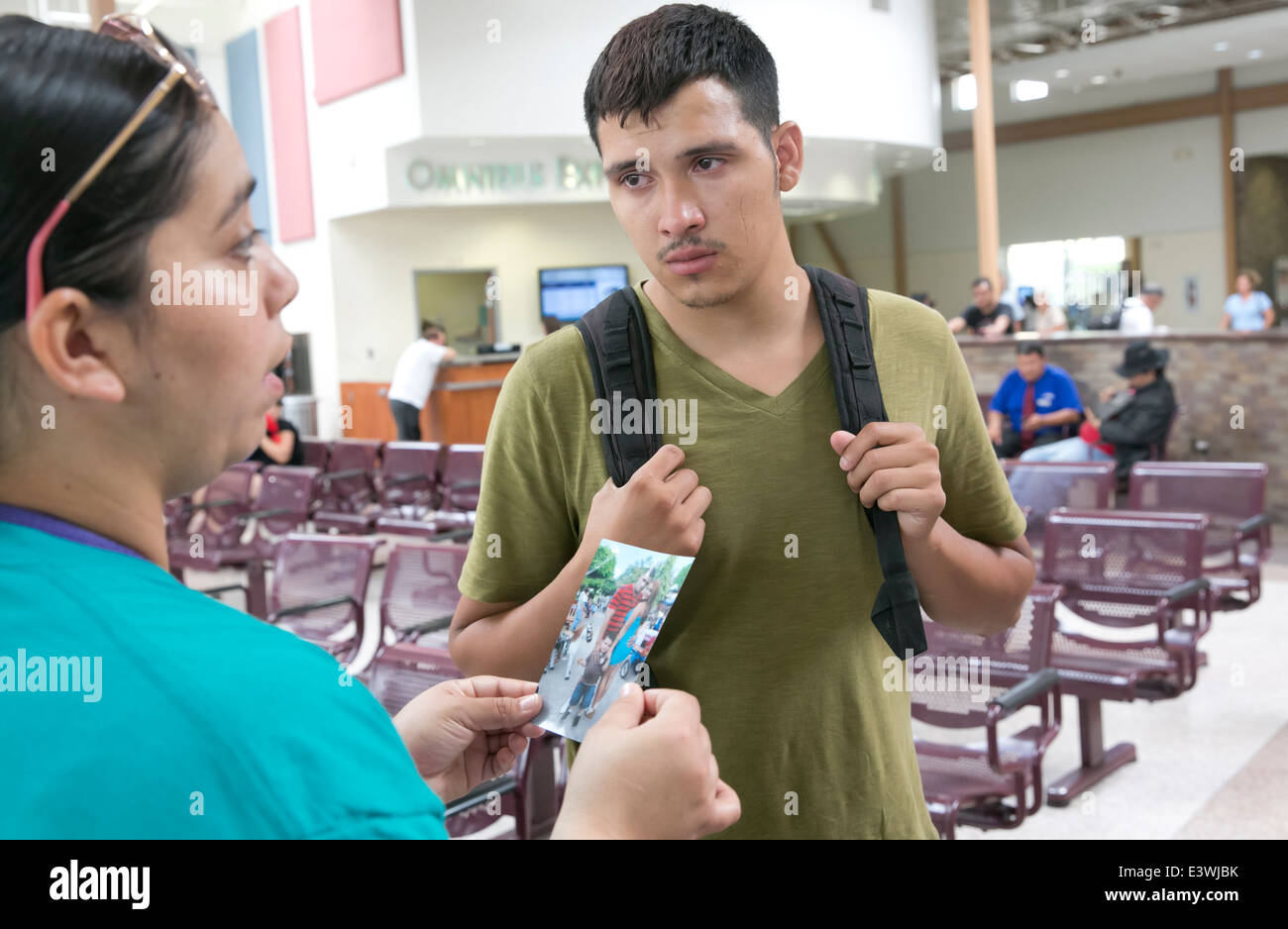 Male US citizen at McAllen, Texas bus station tries to get info on whereabouts of common law wife and child illegally brought Stock Photo