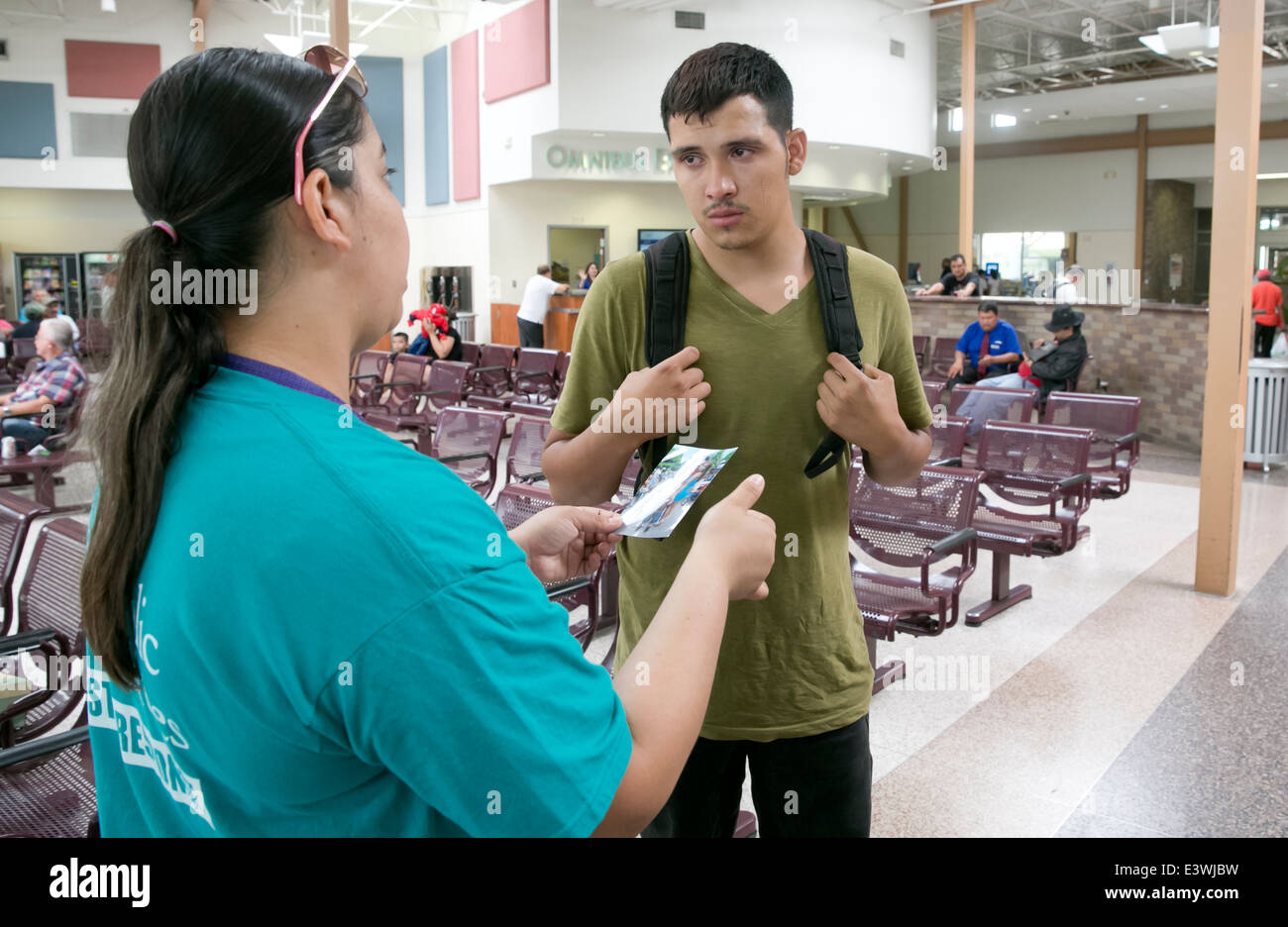 Male US citizen at McAllen, Texas bus station tries to get info on whereabouts of common law wife and child illegally brought Stock Photo