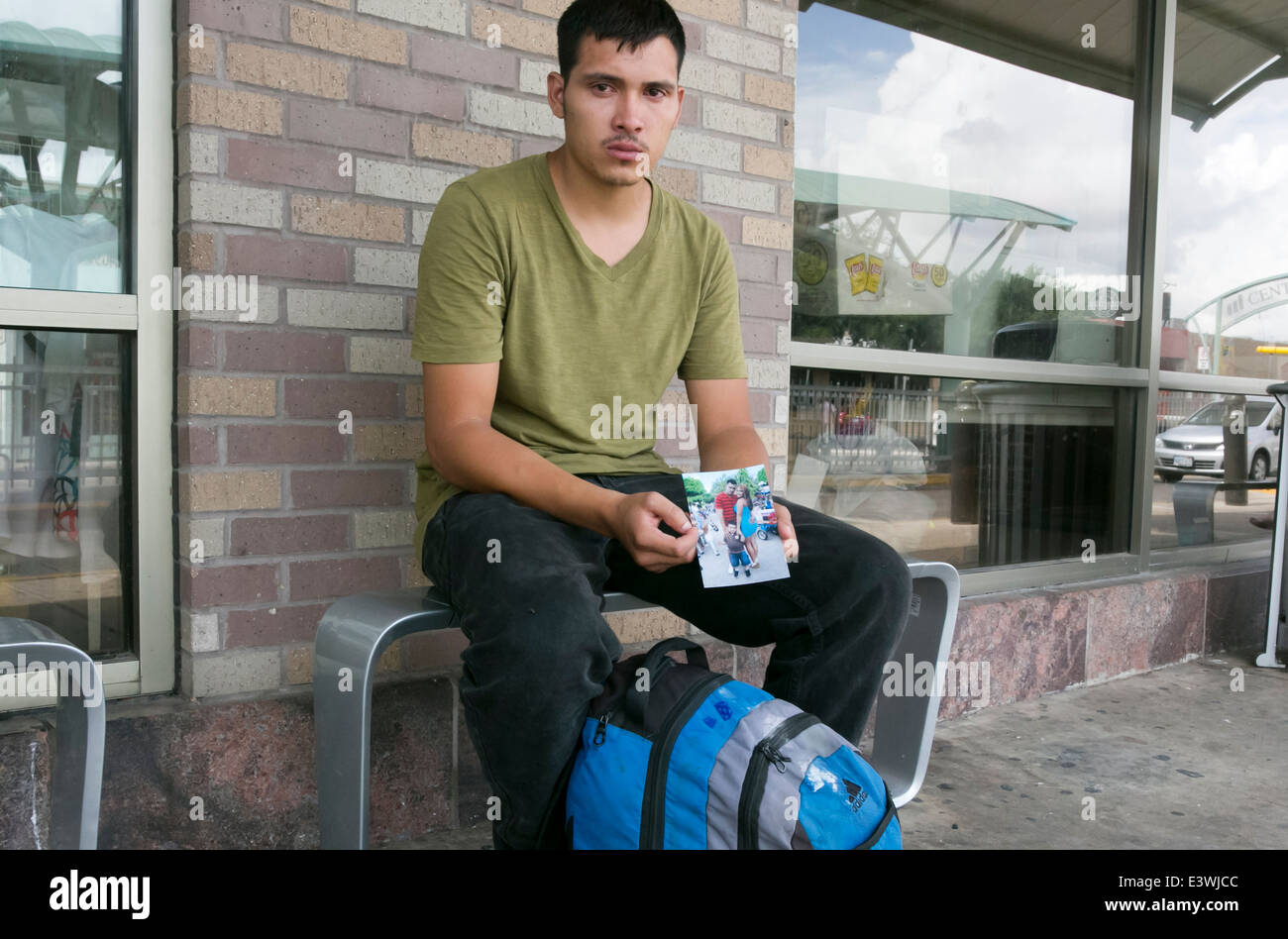 Male US citizen at McAllen, Texas bus station tries to get info on whereabouts of common law wife and child illegally brought Stock Photo