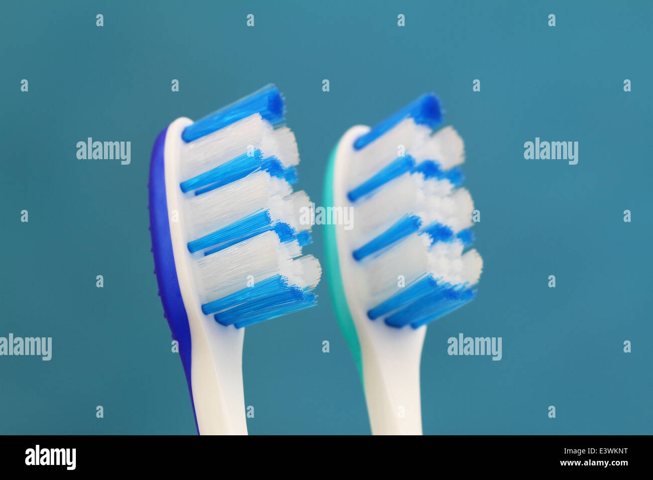 Toothbrushes on blue background Stock Photo - Alamy
