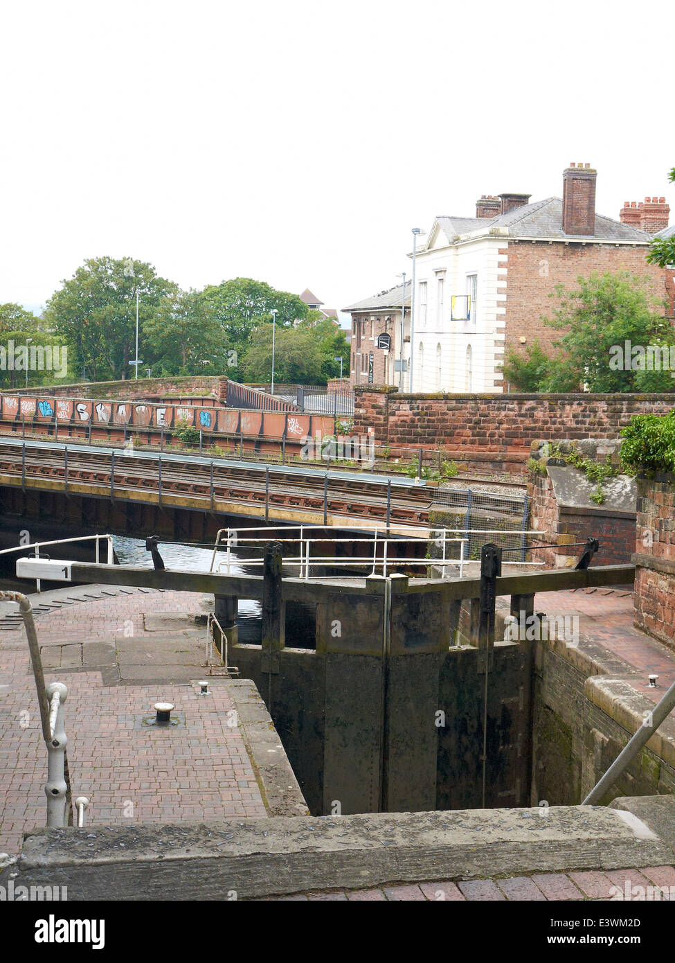 Railway bridge with Northgate lock over Shropshire Union Canal and basin in Chester Cheshire UK Stock Photo