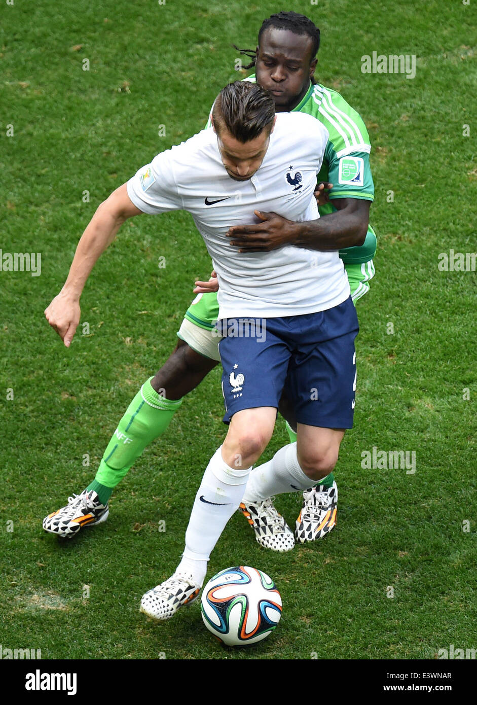 Brasilia, Brazil. 30th June, 2014. France's Mathieu Debuchy vies with Nigeria's Victor Moses during a Round of 16 match between France and Nigeria of 2014 FIFA World Cup at the Estadio Nacional Stadium in Brasilia, Brazil, on June 30, 2014. Credit:  Liu Dawei/Xinhua/Alamy Live News Stock Photo