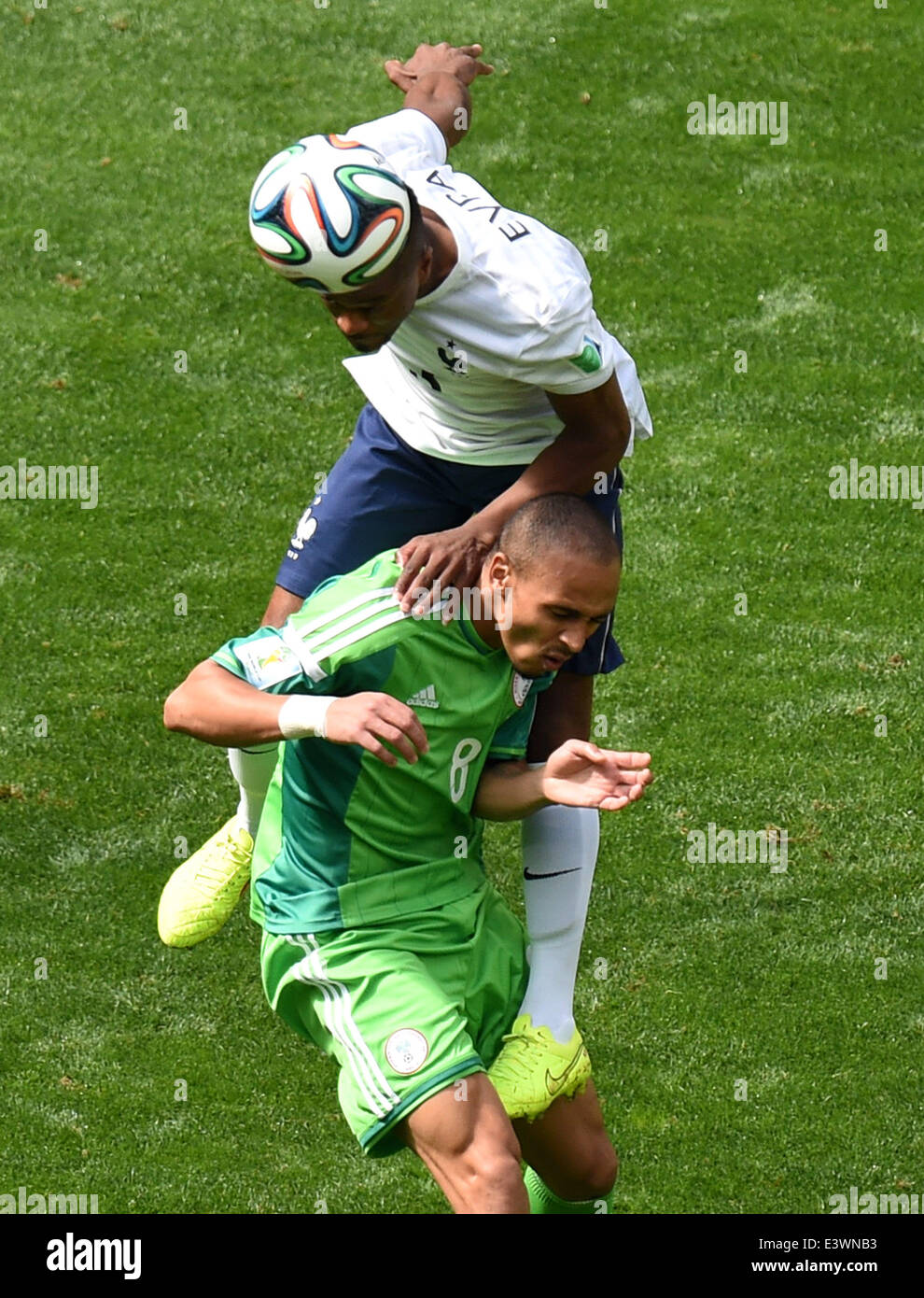 Brasilia, Brazil. 30th June, 2014. France's Patrice Evra vies with Nigeria's Peter Osaze Odemwingie during a Round of 16 match between France and Nigeria of 2014 FIFA World Cup at the Estadio Nacional Stadium in Brasilia, Brazil, on June 30, 2014. Credit:  Liu Dawei/Xinhua/Alamy Live News Stock Photo
