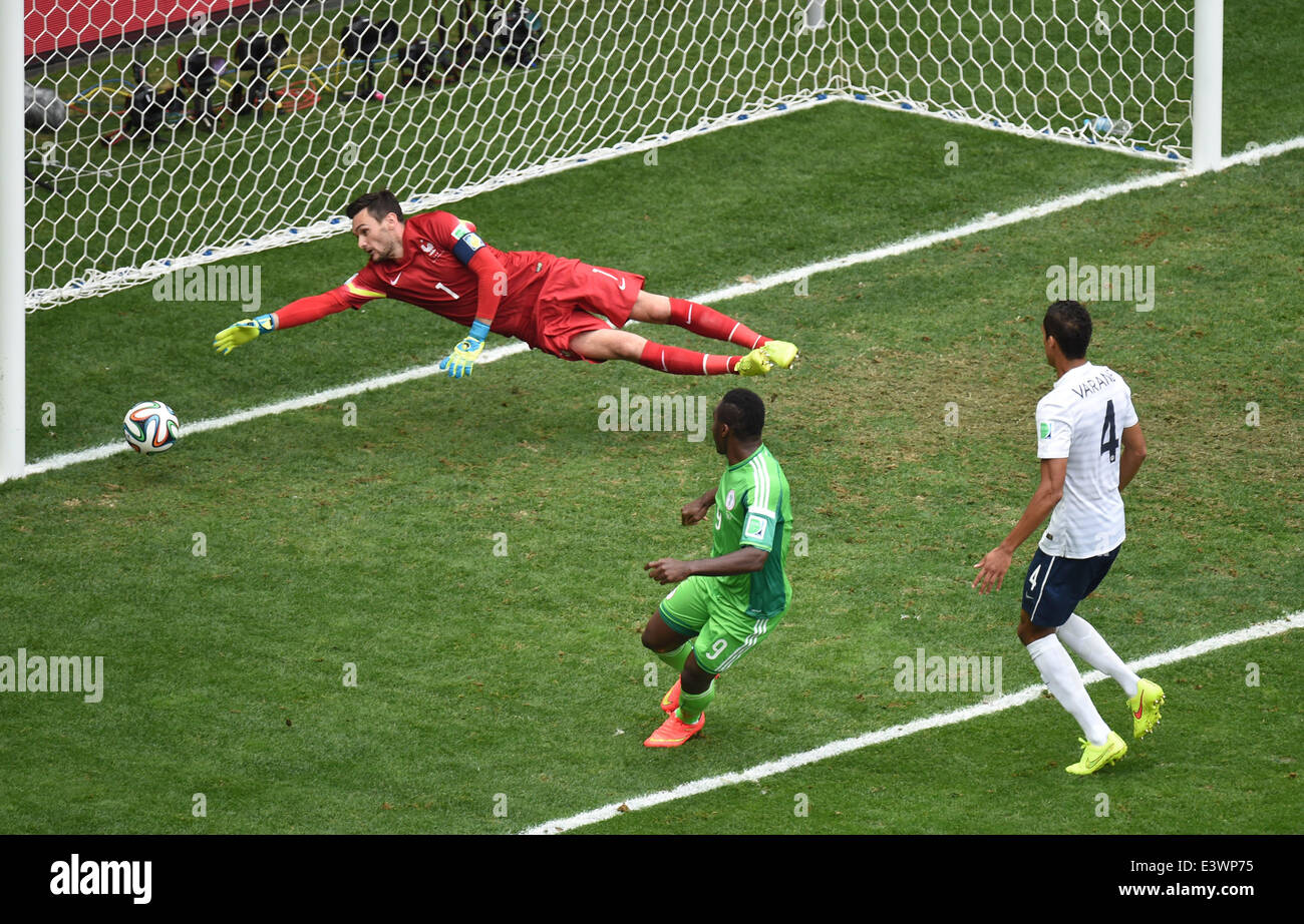 Brasilia, Brazil. 30th June, 2014. Nigeria's Emmanuel Emenike (C) shoots the ball during a Round of 16 match between France and Nigeria of 2014 FIFA World Cup at the Estadio Nacional Stadium in Brasilia, Brazil, on June 30, 2014.  Credit:  Xinhua/Alamy Live News Stock Photo
