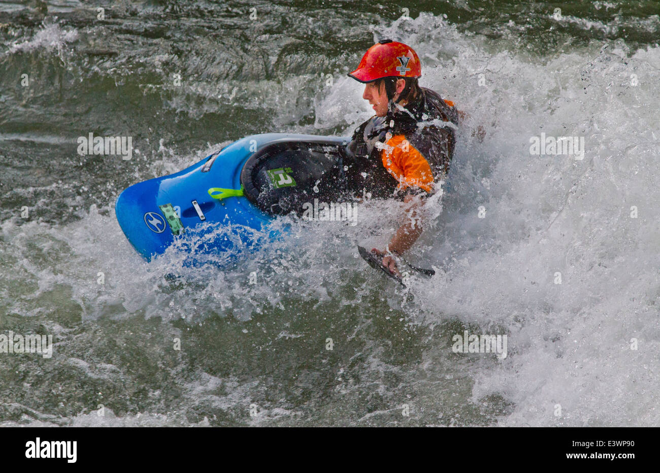 Whitewater kayaker paddling with hand paddles on Ocoee River in