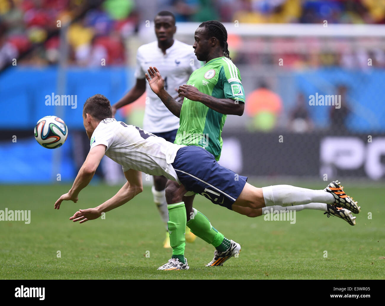 Brasilia, Brazil. 30th June, 2014. Laurent Koscielny (L) of France in action against Victor Moses of Nigeria during the FIFA World Cup 2014 round of 16 match between France and Nigeria at the Estadio National Stadium in Brasilia, Brazil, on 30 June 2014. Credit:  dpa picture alliance/Alamy Live News Stock Photo
