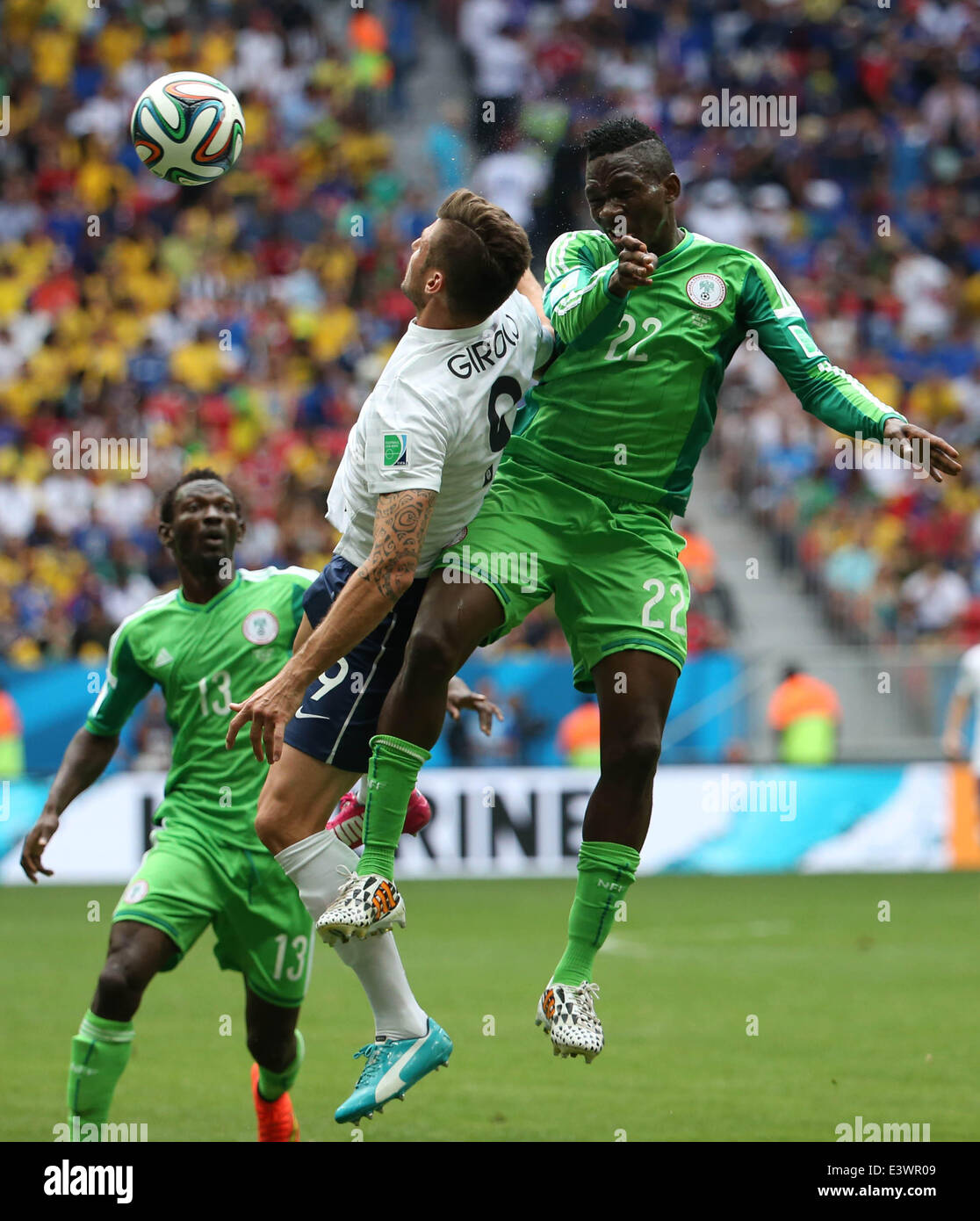 Brasilia, Brazil. 30th June, 2014. France's Olivier Giroud vies with Nigeria's Kenneth Omeruo during a Round of 16 match between France and Nigeria of 2014 FIFA World Cup at the Estadio Nacional Stadium in Brasilia, Brazil, on June 30, 2014. Credit:  Xinhua/Alamy Live News Stock Photo
