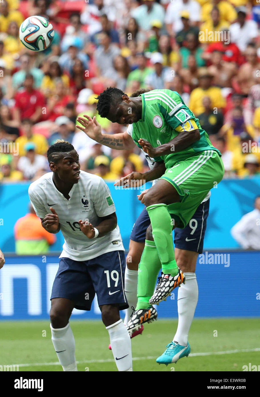 Brasilia, Brazil. 30th June, 2014. Nigeria's Joseph Yobo jumps for the ball during a Round of 16 match between France and Nigeria of 2014 FIFA World Cup at the Estadio Nacional Stadium in Brasilia, Brazil, on June 30, 2014. Credit:  Xinhua/Alamy Live News Stock Photo