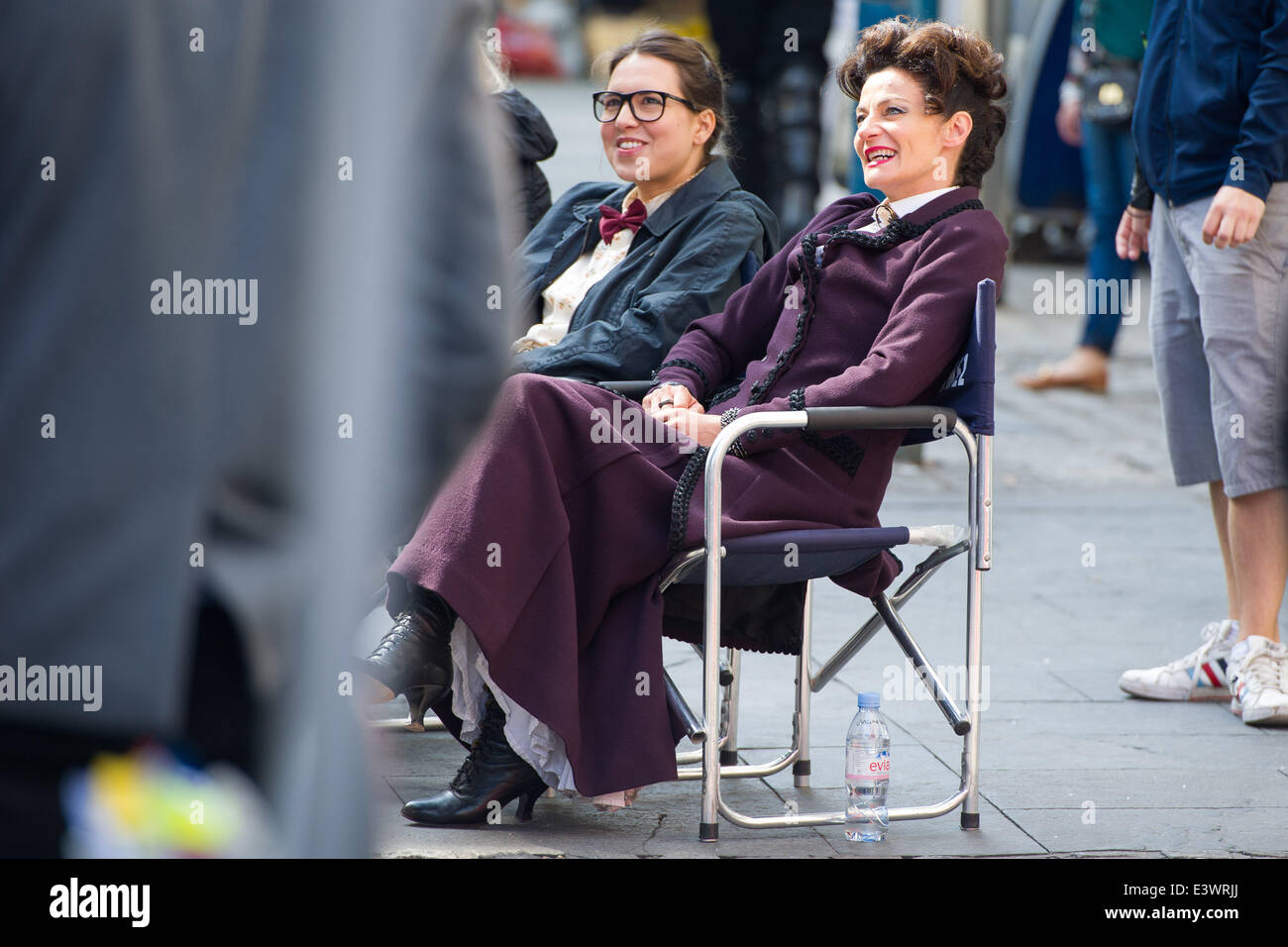 Cardiff, UK. 30th June 2014. The cast of BBC Doctor Who are spotted filming in Cardiff city centre. The Doctor (Peter Capaldi) was seen standing off against the Cybermen with UNIT soldiers and actress Michelle Gomez. Photo shows Ingrid Oliver (L) who plays Osgood, and Michelle Gomez (R) Credit:  Polly Thomas/Alamy Live News Stock Photo