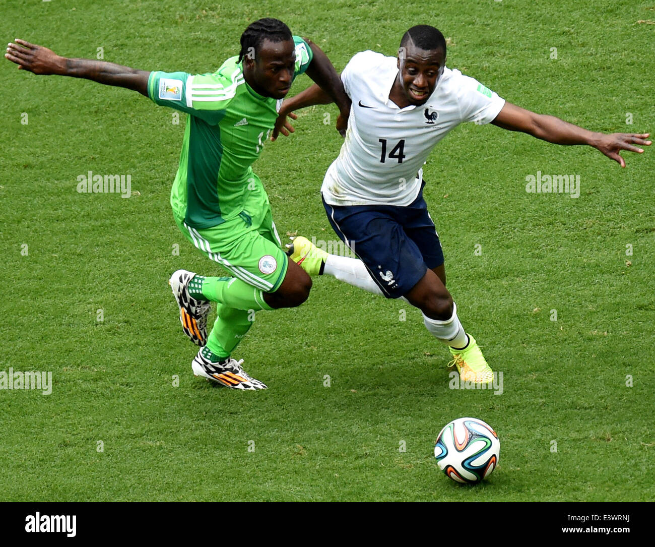 Brasilia, Brazil. 30th June, 2014. France's Blaise Matuidi (R) vies with Nigeria's Victor Moses during a Round of 16 match between France and Nigeria of 2014 FIFA World Cup at the Estadio Nacional Stadium in Brasilia, Brazil, on June 30, 2014. Credit:  Liu Dawei/Xinhua/Alamy Live News Stock Photo