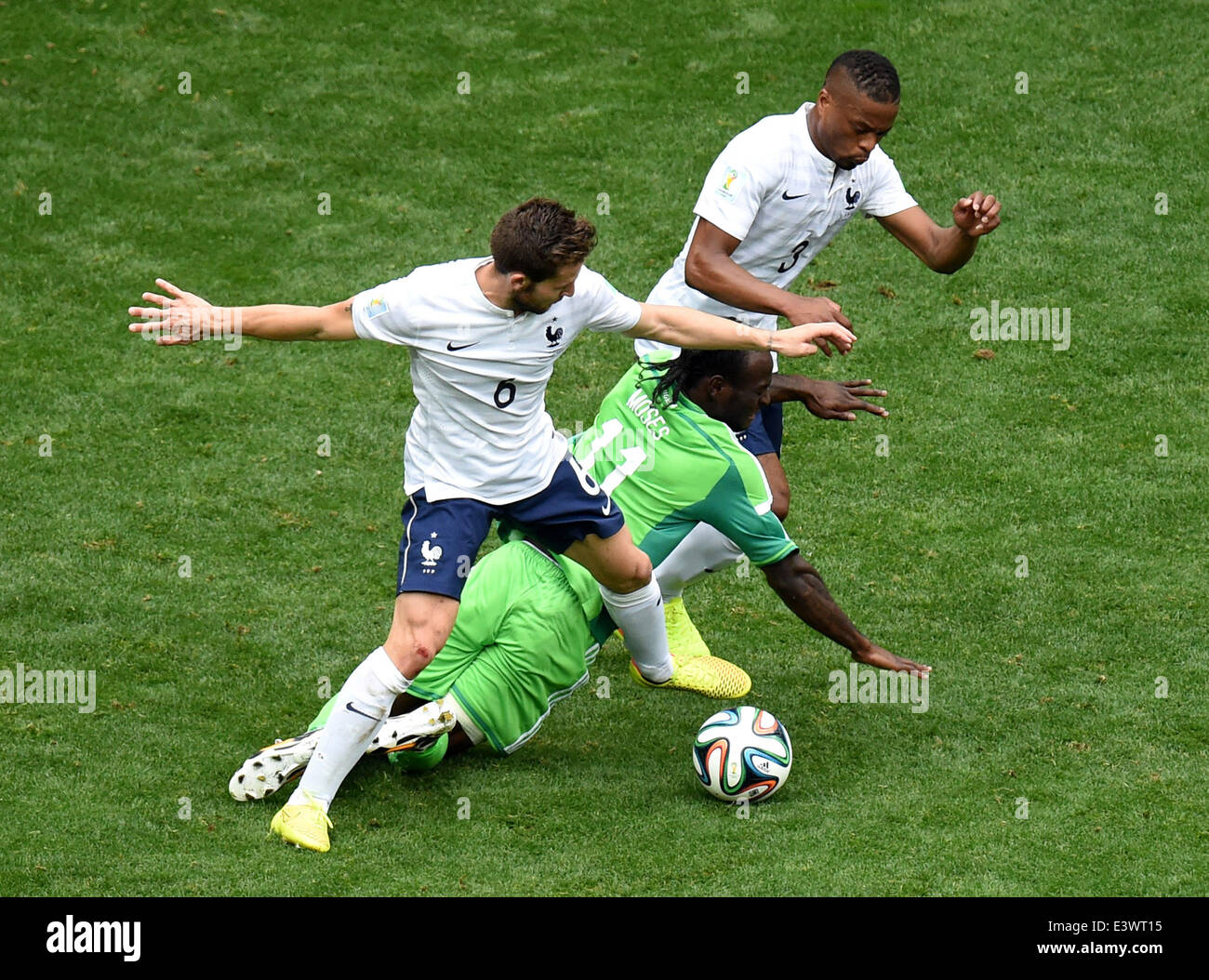 Brasilia, Brazil. 30th June, 2014. Nigeria's Victor Moses (C) falls down during a Round of 16 match between France and Nigeria of 2014 FIFA World Cup at the Estadio Nacional Stadium in Brasilia, Brazil, on June 30, 2014.  Credit:  Xinhua/Alamy Live News Stock Photo