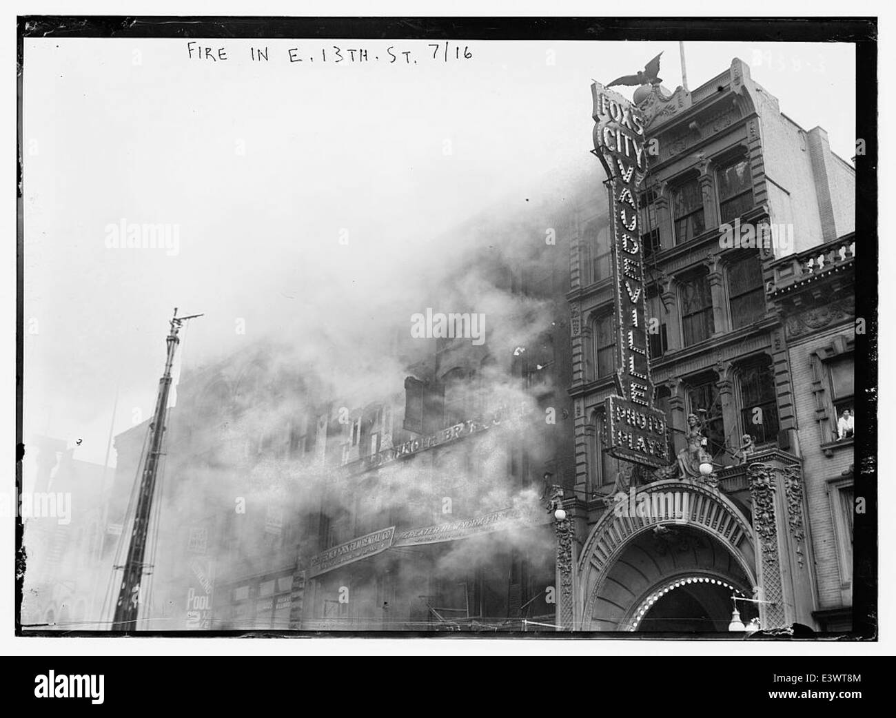 This photograph captures a fire on East 13th Street in 1916. The image ...