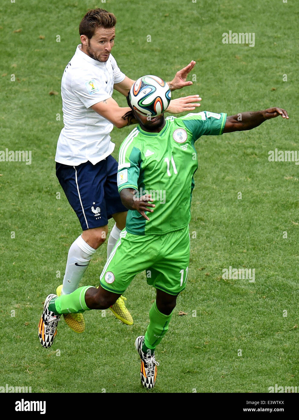 Brasilia, Brazil. 30th June, 2014. France's Yohan Cabaye (L) vies with Nigeria's Victor Moses during a Round of 16 match between France and Nigeria of 2014 FIFA World Cup at the Estadio Nacional Stadium in Brasilia, Brazil, on June 30, 2014. Credit:  Liu Dawei/Xinhua/Alamy Live News Stock Photo