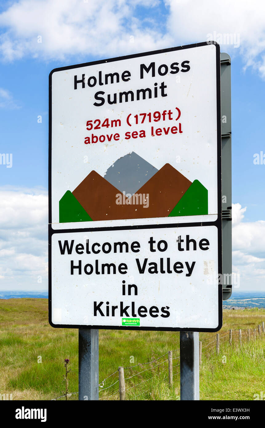 Sign at summit of Holme Moss, one of steepest climbs in UK stage of 2014 Tour de France, Holme Valley, Kirklees, W Yorkshire, UK Stock Photo