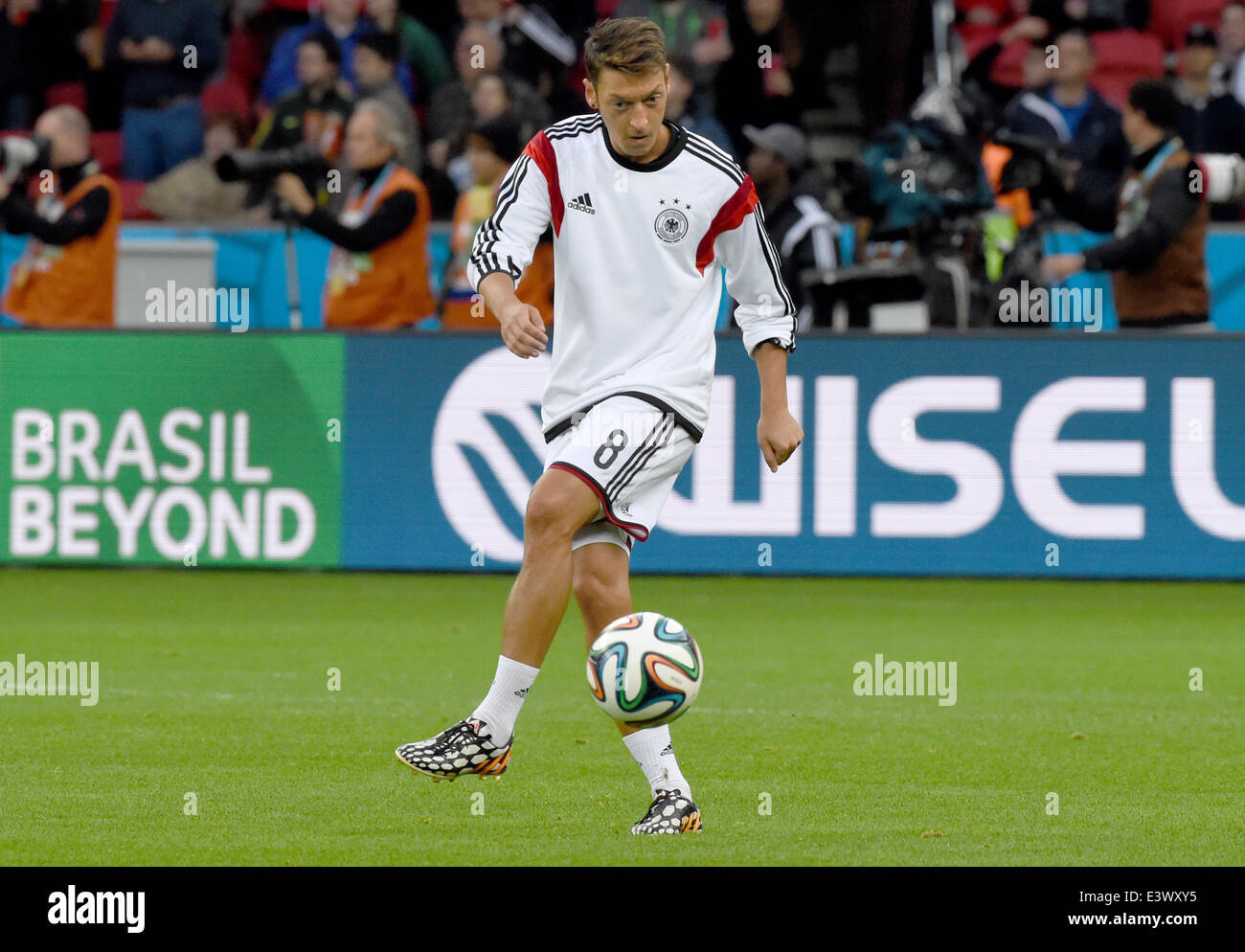Porto Alegre, Brazil. 30th June, 2014. Germany's Mesut Oezil warms up prior to the FIFA World Cup 2014 round of 16 soccer match between Germany and Algeria at the Estadio Beira-Rio in Porto Alegre, Brazil, 30 June 2014. Credit:  dpa picture alliance/Alamy Live News Stock Photo