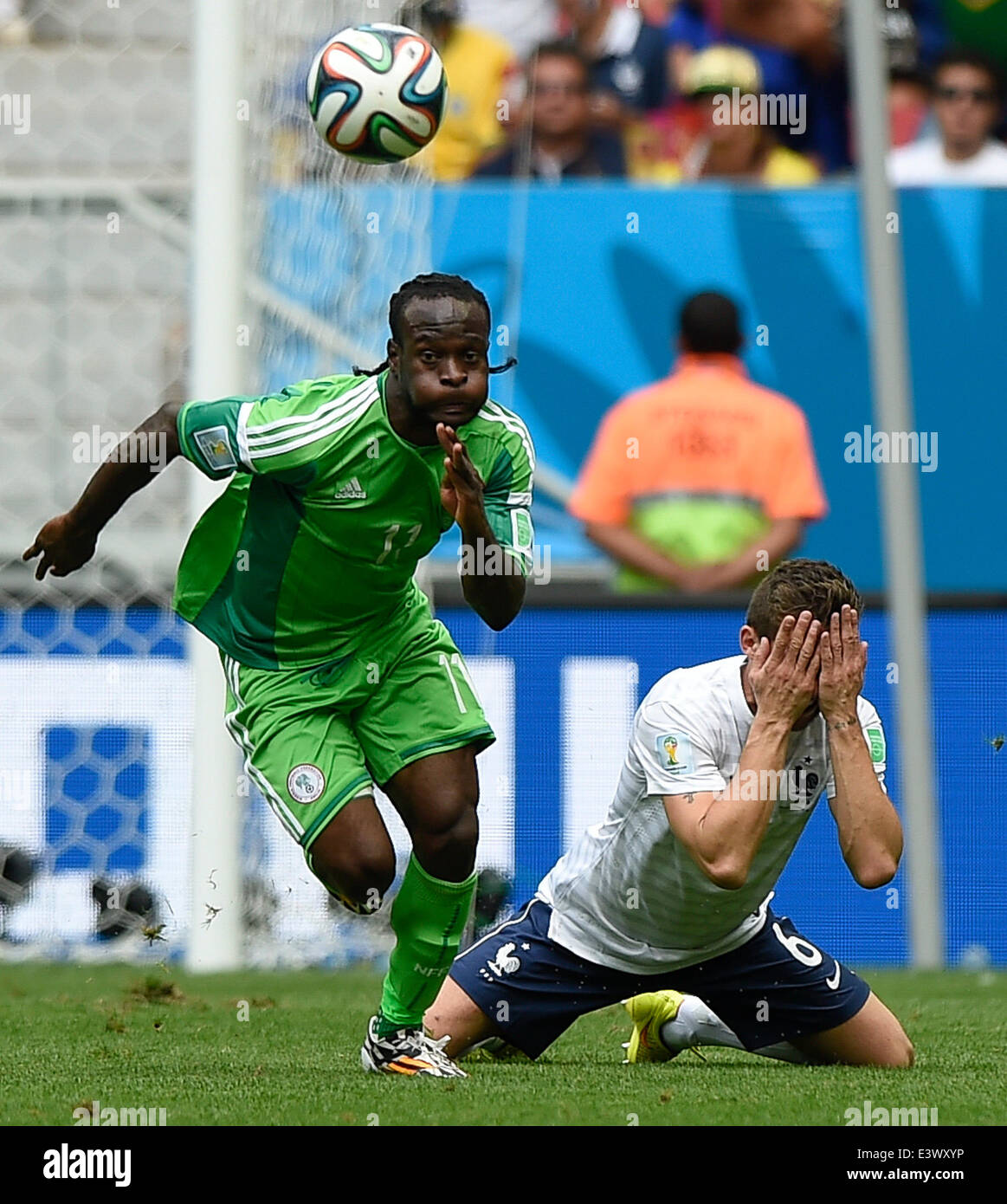 Brasilia, Brazil. 30th June, 2014. France's Yohan Cabaye vies with Nigeria's Victor Moses during a Round of 16 match between France and Nigeria of 2014 FIFA World Cup at the Estadio Nacional Stadium in Brasilia, Brazil, on June 30, 2014. France won 2-0 over Nigeria and qualified for quarter-finals here on Monday. Credit:  Xinhua/Alamy Live News Stock Photo