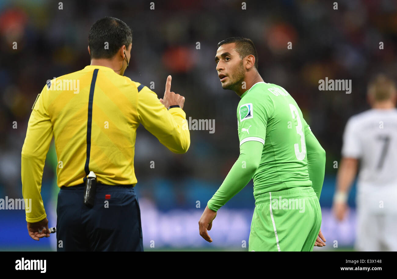 Porto Alegre, Brazil. 30th June, 2014. Referee Sandro Ricci of Brazil talks to Faouzi Ghoulam of Algeria during the FIFA World Cup 2014 round of 16 soccer match between Germany and Algeria at the Estadio Beira-Rio in Porto Alegre, Brazil, 30 June 2014. Photo: Andreas Gebert/dpa/Alamy Live News Stock Photo