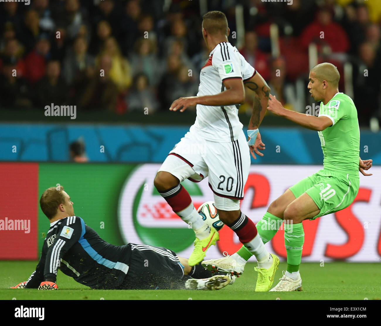 Porto Alegre, Brazil. 30th June, 2014. Germany's goalkeeper Manuel Neuer (L) saves the ball during a Round of 16 match between Germany and Algeria of 2014 FIFA World Cup at the Estadio Beira-Rio Stadium in Porto Alegre, Brazil, on June 30, 2014. Credit:  Li Ga/Xinhua/Alamy Live News Stock Photo